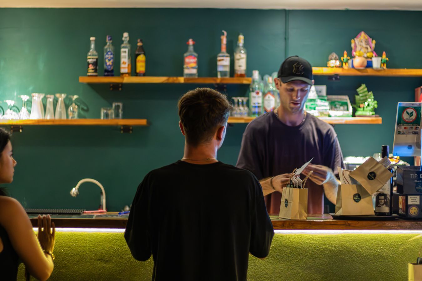 Customers enjoying the atmosphere at Magical Weed Garden cannabis café